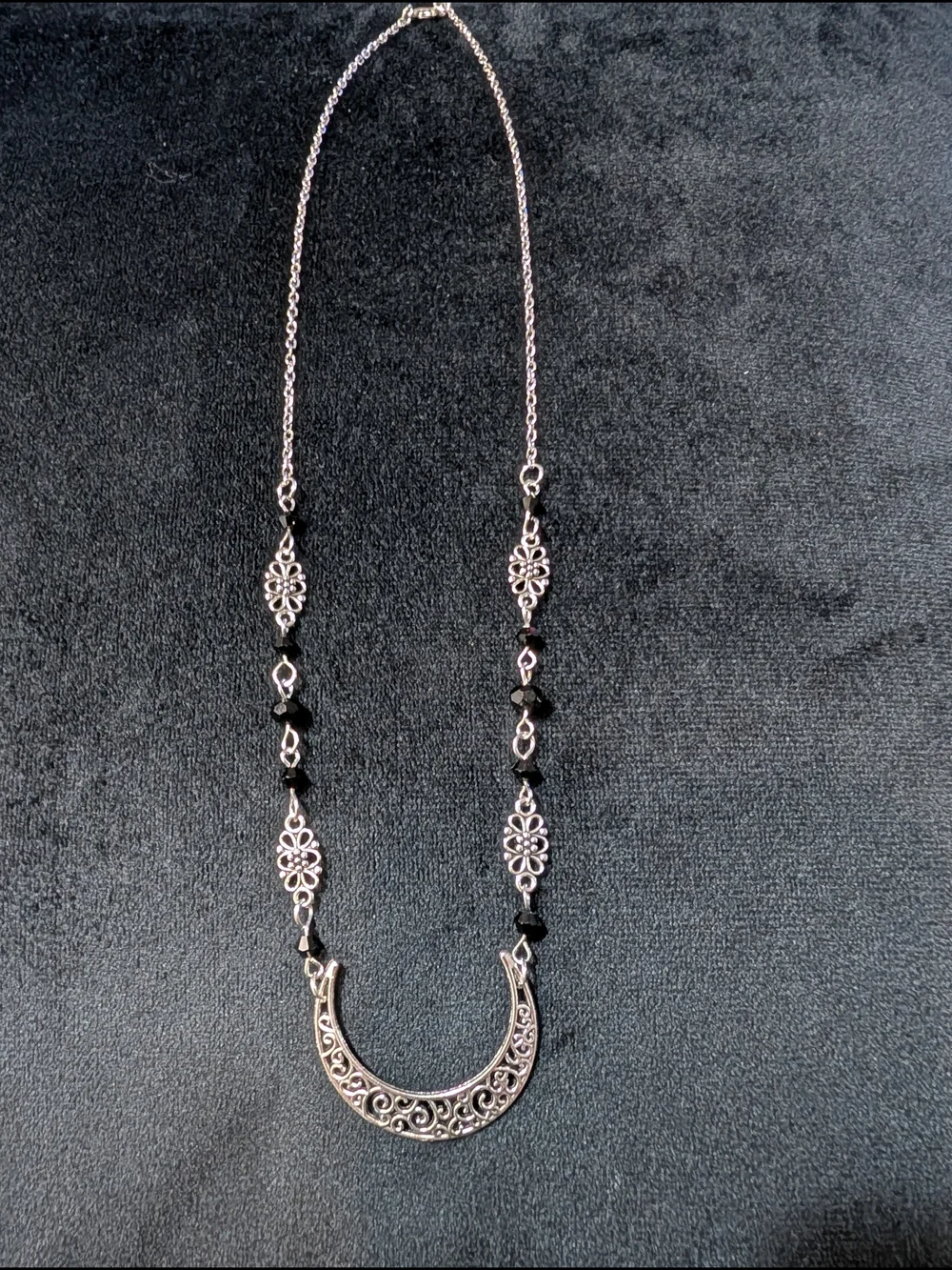 Silver Tone Filigree Crescent Pendant Necklace with Black Accents